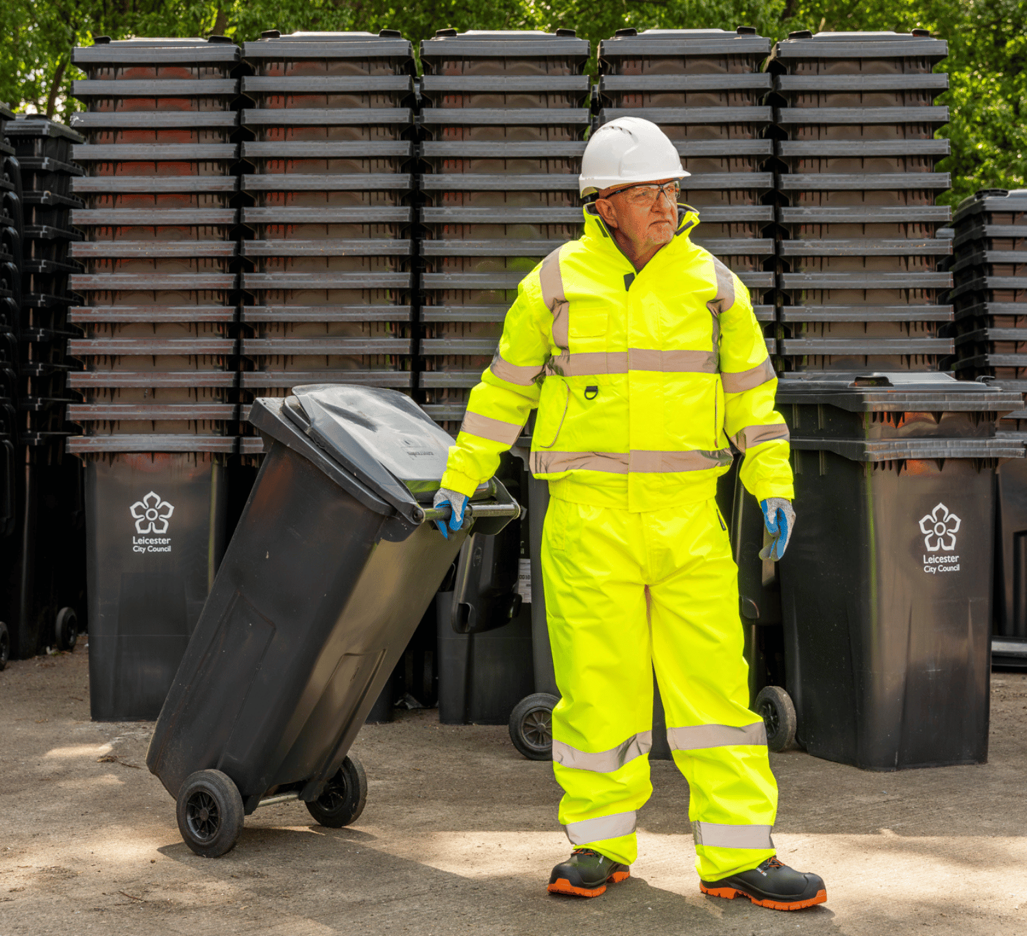 Man wearing yellow hi-vis safety clothing and PPE