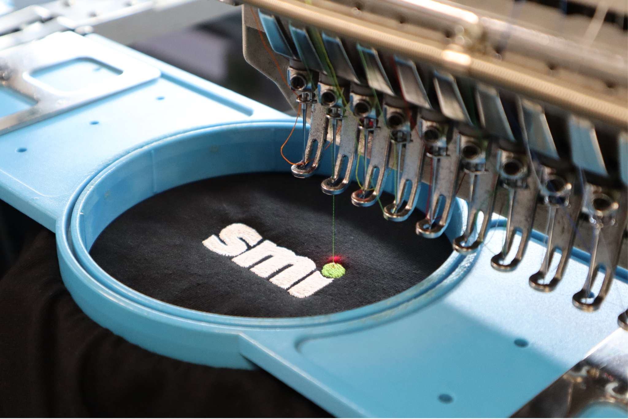 Emroboidery head in use - SMI branding