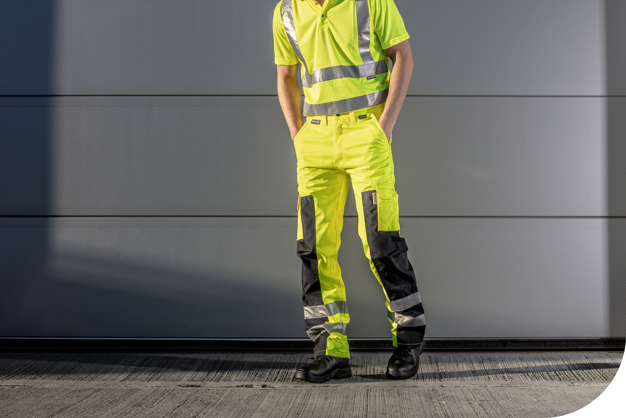 Man wearing hi-vis yellow trousers.