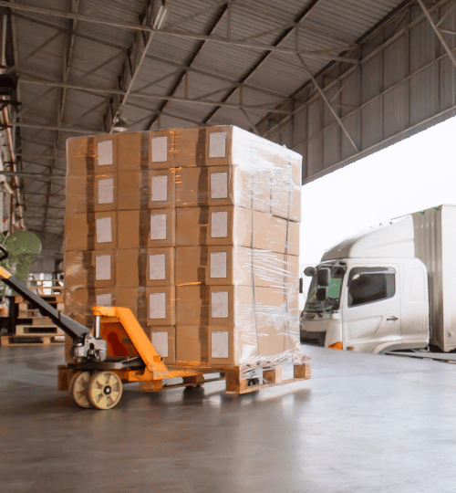 Loading road freight shipping containers.