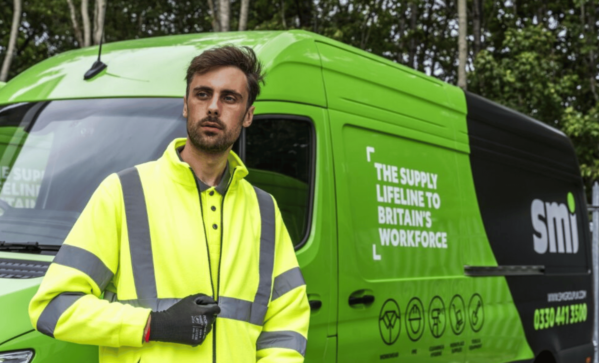 Man wearing yellow hi-vis PPE.