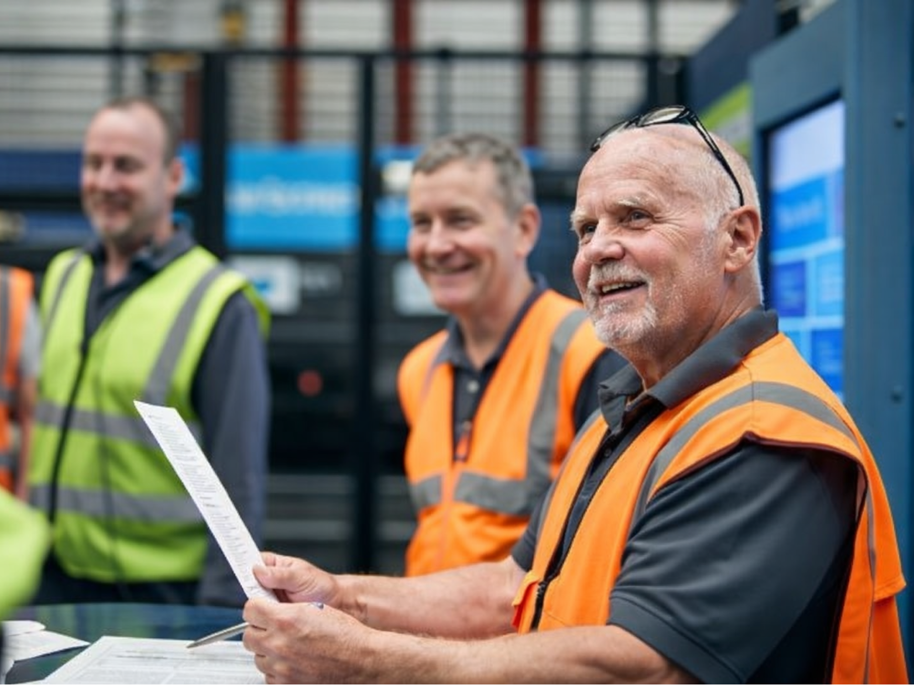 Man in orange hi-vis PPE