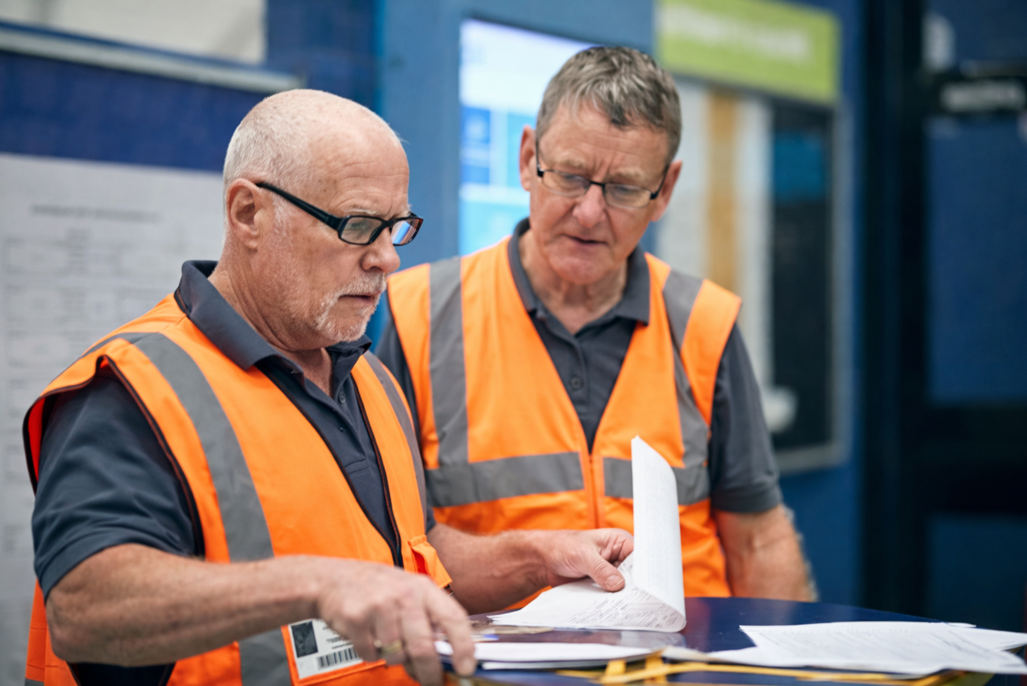 Man in orange hi-vis PPE